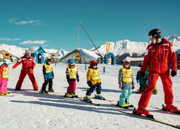 Family ski resort, children take ski lessons