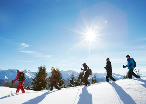 Snowshoeing in the Fiss ski area in sunshine and fresh snow